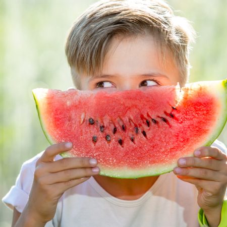 Funny,Kid,Eating,Watermelon,Outdoors,In,Summer,Park,,Focus,On